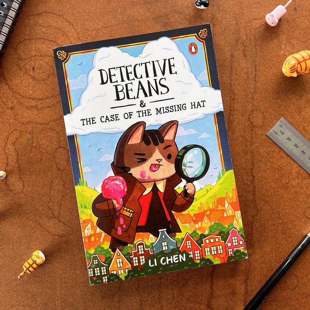 Book titled 'Detective Beans & The Case of the Missing Hat' by Li Chen on a wooden surface.