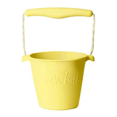 Yellow bucket with handle on a white background