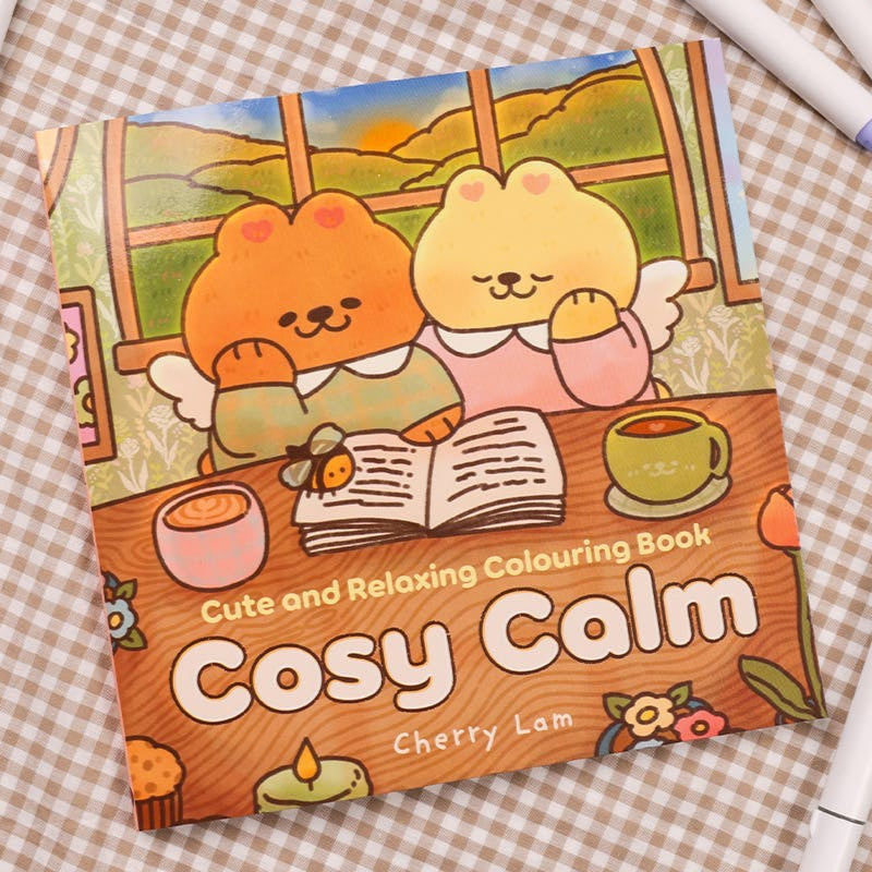 Coloring book titled 'Cosy Calm' with cartoon characters on a checkered background